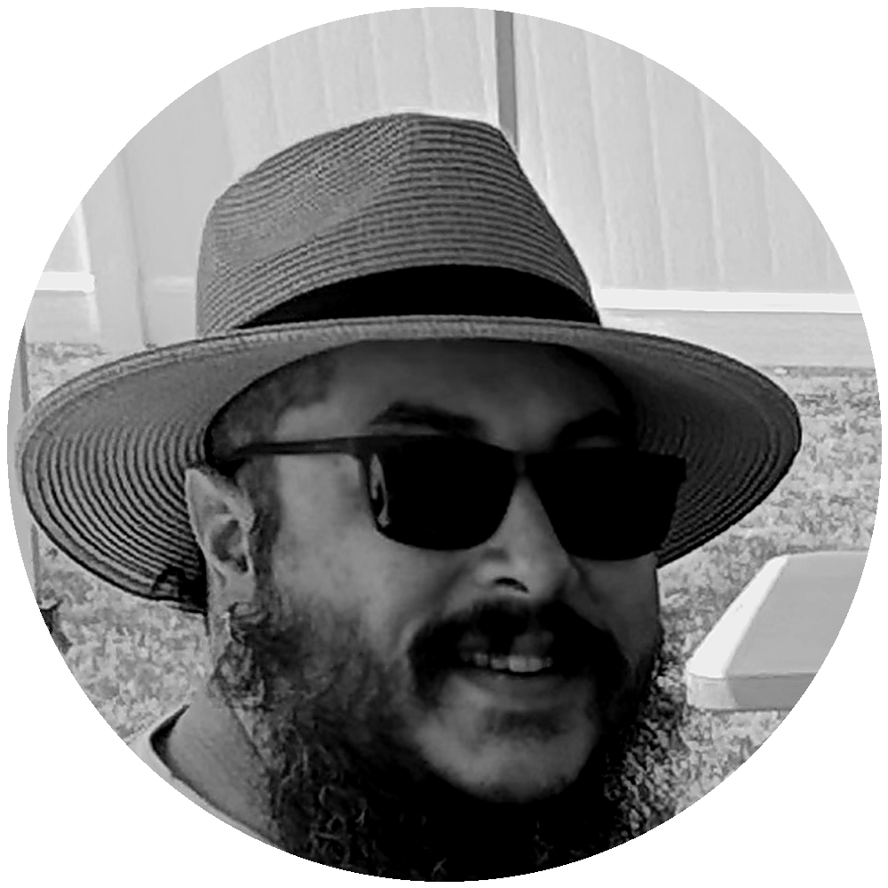 Ivan wearing sunglasses and a wide-brim hat